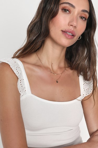 Lovely Outlook Ivory Ribbed Ruffle Strap Tank Top