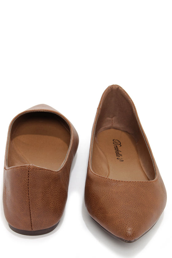 pointy tan flats
