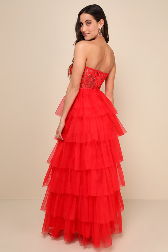 A timeless strapless black lace gown with intricate floral A timeless strapless black lace gown with intricate floral