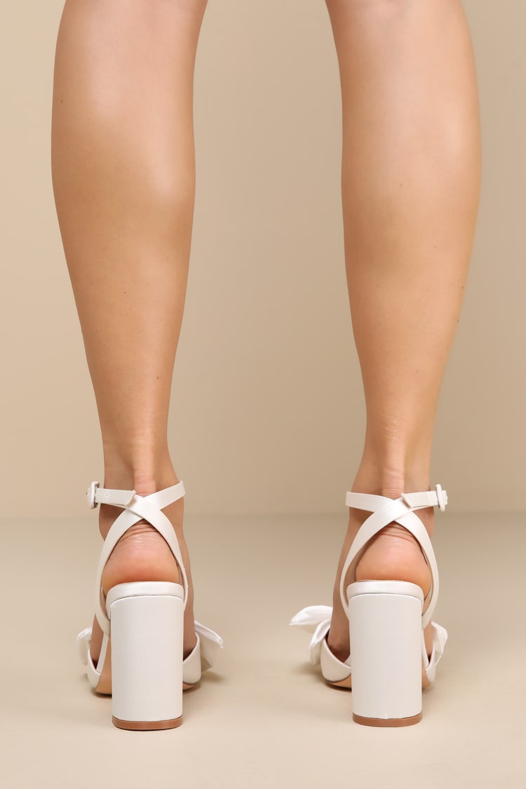 Suttonn Ivory Satin Bow Ankle Strap Pointed-Toe Pumps