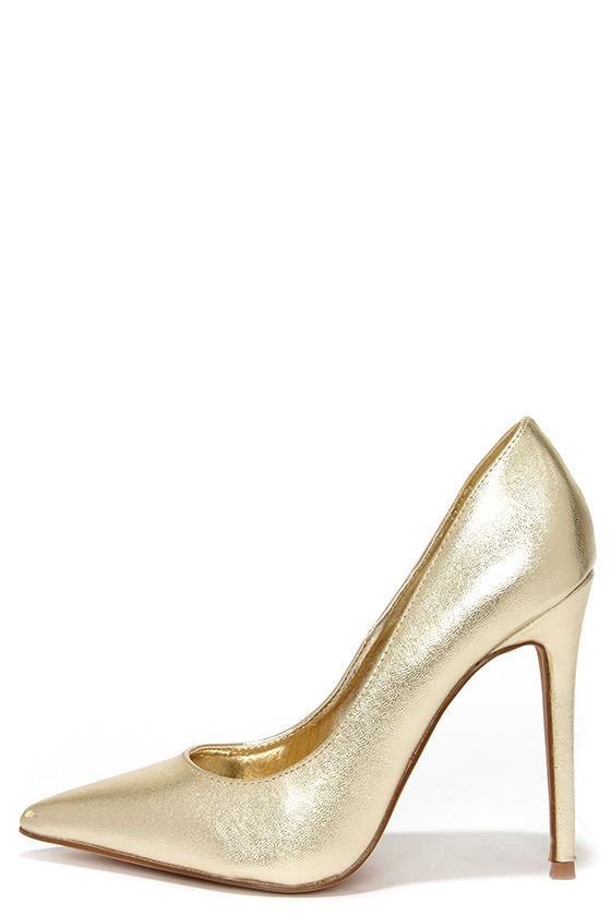 white pumps with gold heel