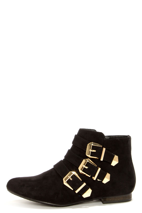 black ankle boots with gold buckles