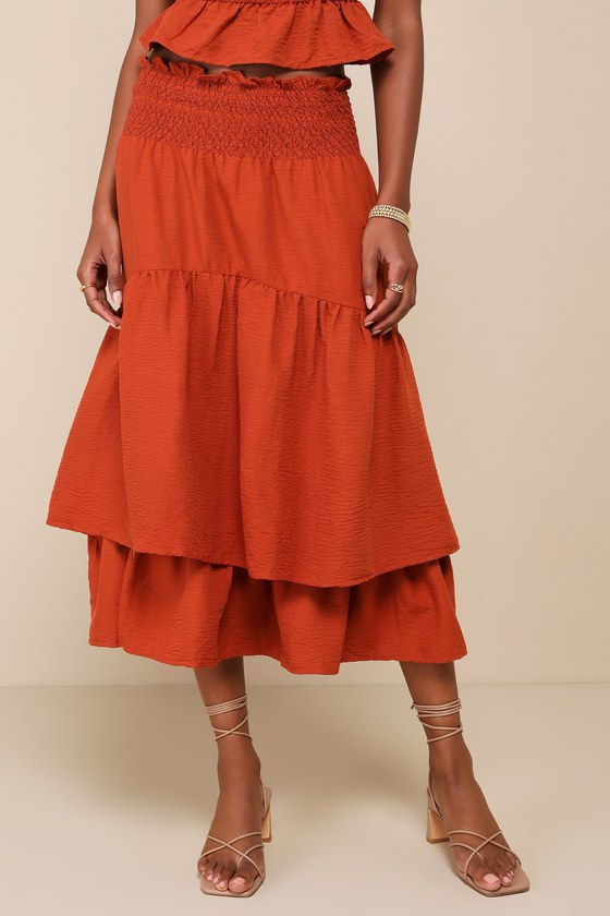 Jacquie The Label Exceedingly Effortless Rust Orange Smocked Tiered Midi Skirt In Rust Orange