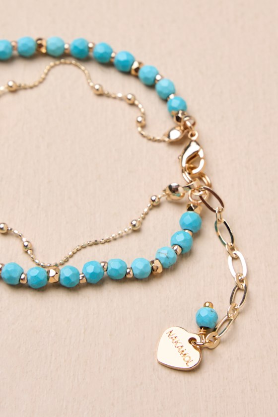 LULUS BOHO CUTIE GOLD AND TURQUOISE BEADED FEATHER LAYERED BRACELET