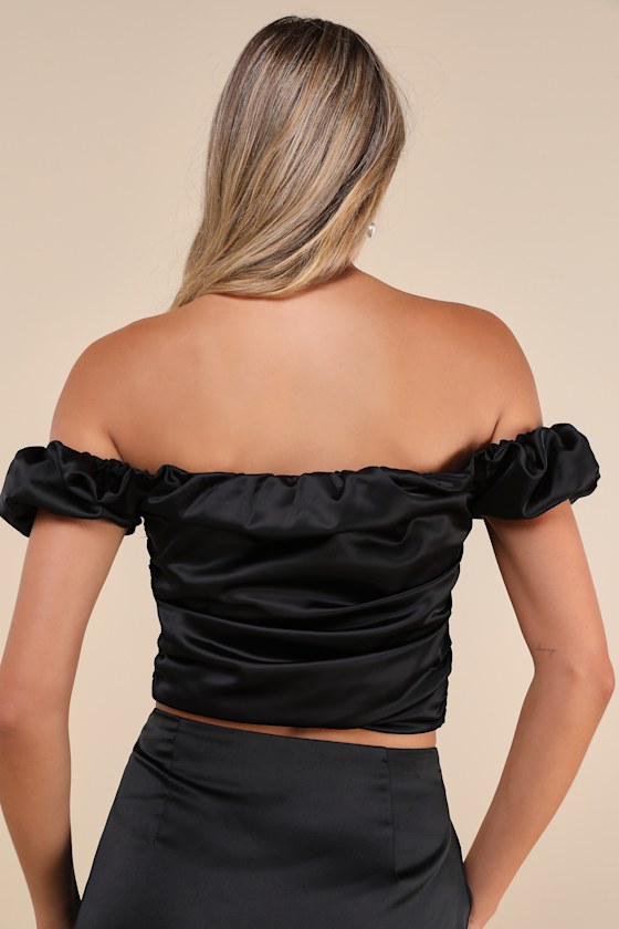 Zemeta Black Rose Satin Rosette Off-the-shoulder Puff Sleeve Top In Black