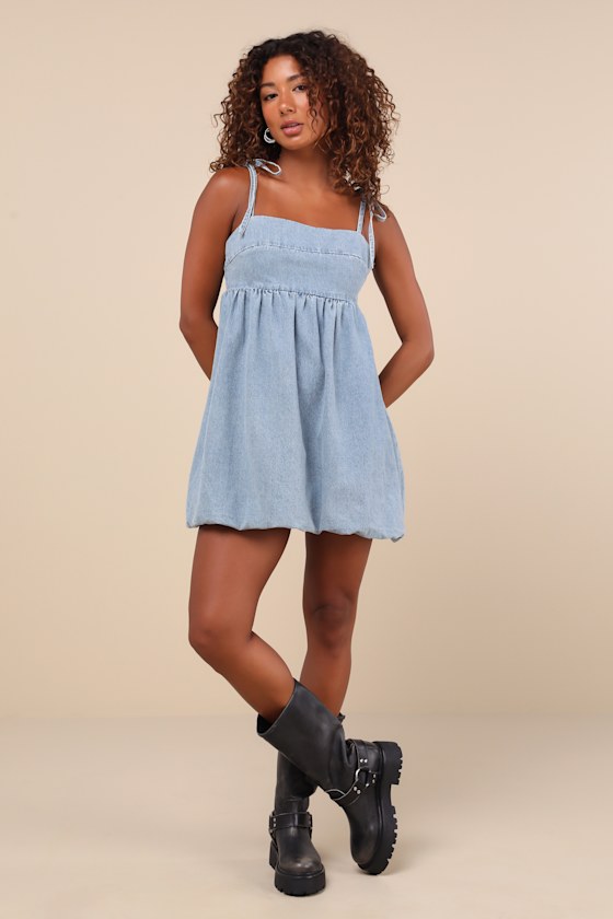 Lulus Charmed Aura Light Wash Denim Tie-strap Bubble-hem Mini Dress In Blue