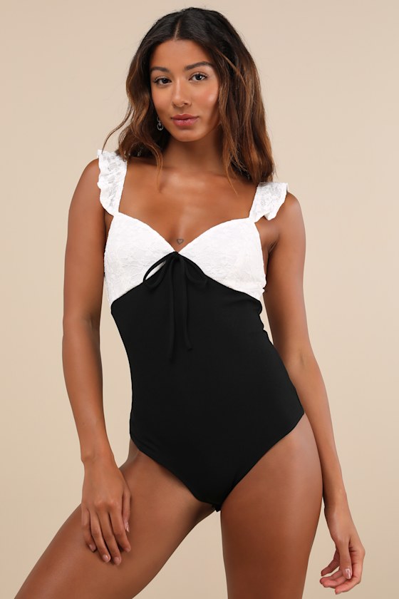 Lulus Marvelous Sweetie Ivory And Black Lace Ruffled Bow Bodysuit In Black
