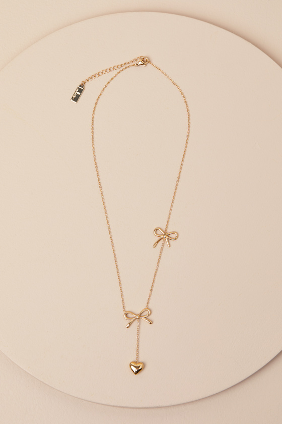 LULUS ELSY GOLD BOW AND HEART DROP NECKLACE