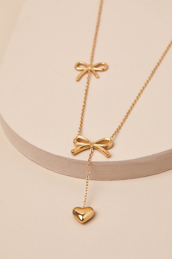 LULUS ELSY GOLD BOW AND HEART DROP NECKLACE