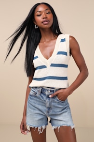The Knockout Medium Wash Raw Hem Denim Shorts