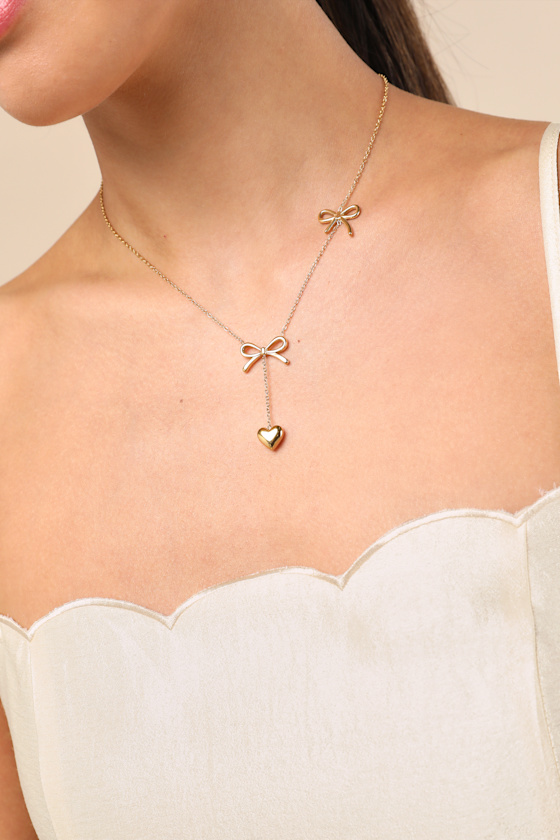 LULUS ELSY GOLD BOW AND HEART DROP NECKLACE