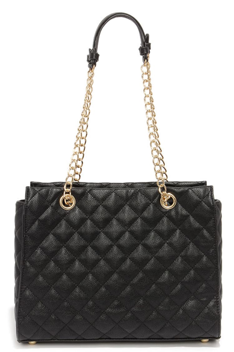 Premium AI Image  A close up of a black quilted bag with the word