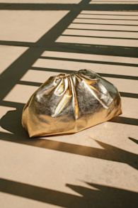 Get Your Trend On Metallic Gold Ruched Clutch 1
