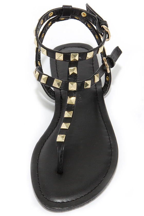 black sandals with gold trim