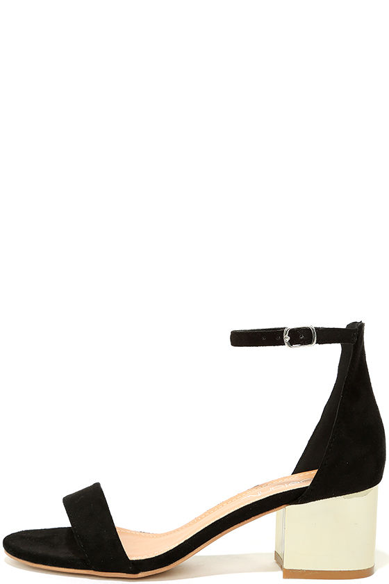 black high heels with gold ankle strap