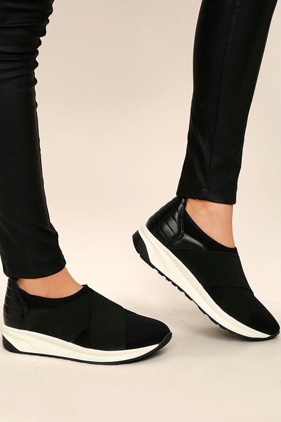 black slip on sneakers with black soles