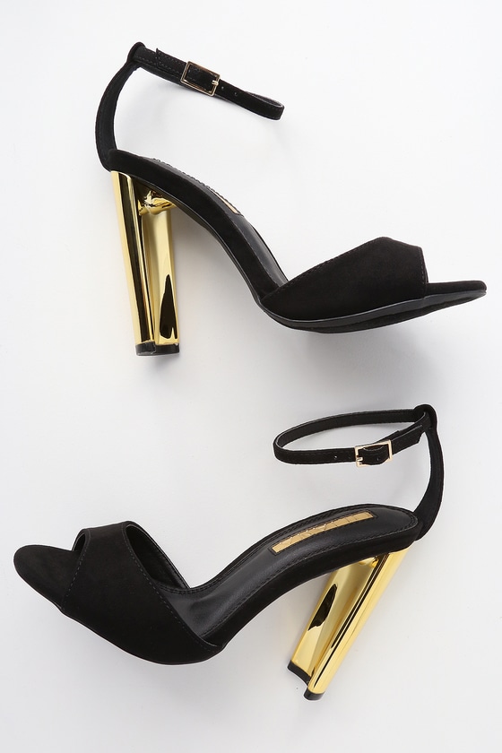 black heels with gold heel