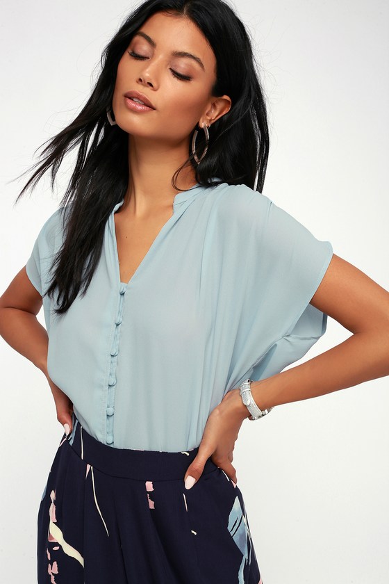 blue button up with black pants