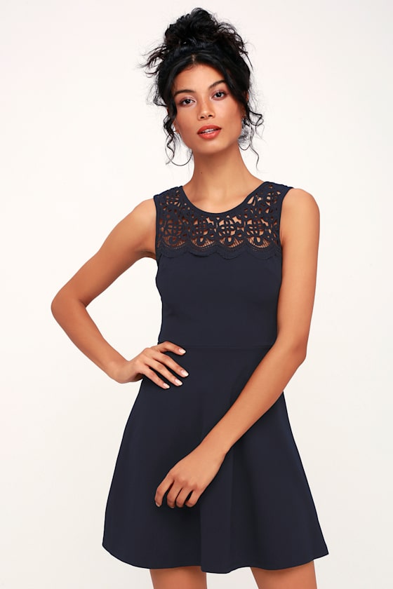 According to Love Navy Blue Lace Skater Dress - Let the Lulus According to Love Navy Blue Lace Skater Dress sweep you off your feet! The classic skater dress silhouette gets a flirty, feminine update with lovely crochet lace that shapes an illusion neckline atop a fitted, darted bodice. The lightweight woven composition continues into a fitted waist and a chic skater skirt that falls to a flirty length. Hidden back zipper.