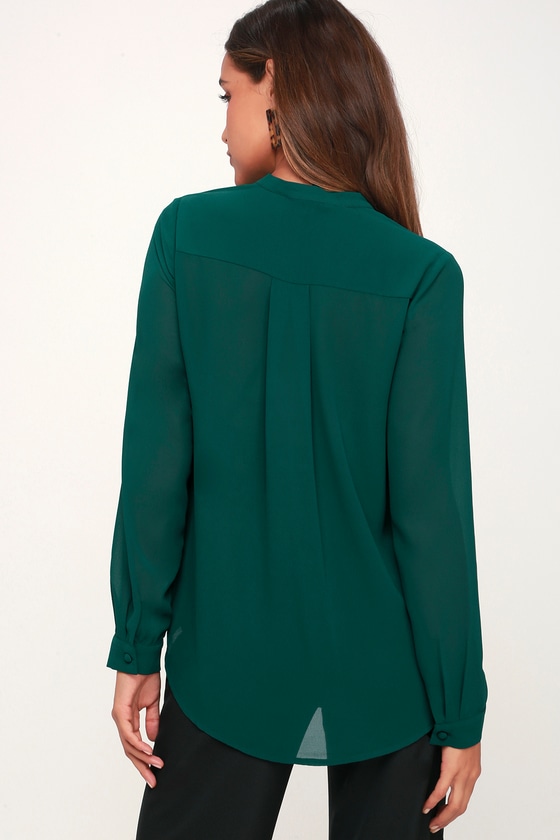 green blouse and white pants