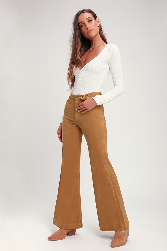 Flared trousers in coated fabric