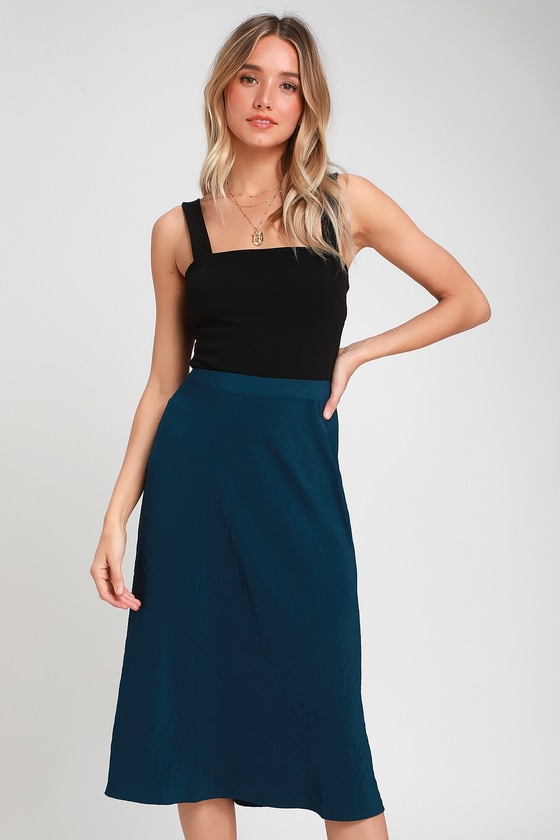 black top with navy blue skirt