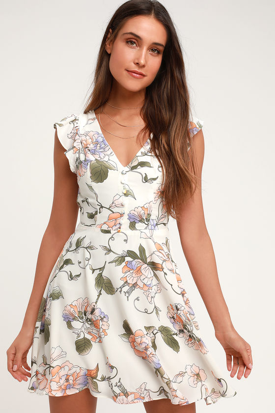 Garden Love Cream Floral Print Backless Skater Dress - Lulus Exclusive! Spend a day among the flowers in the Lulus Garden Love Cream Floral Print Backless Skater Dress! These sweet little skater dress (composed of gauzy woven fabric) boasts a romantic lavender, green, and lavender floral print and a sexy V-neckline. Gathered ruffles decorate the sleeveless bodice white a decorative button placket adds cute detail. Wide back keyhole is secured with a round button. Slightly flared mini skirt. Hidden back zipper.