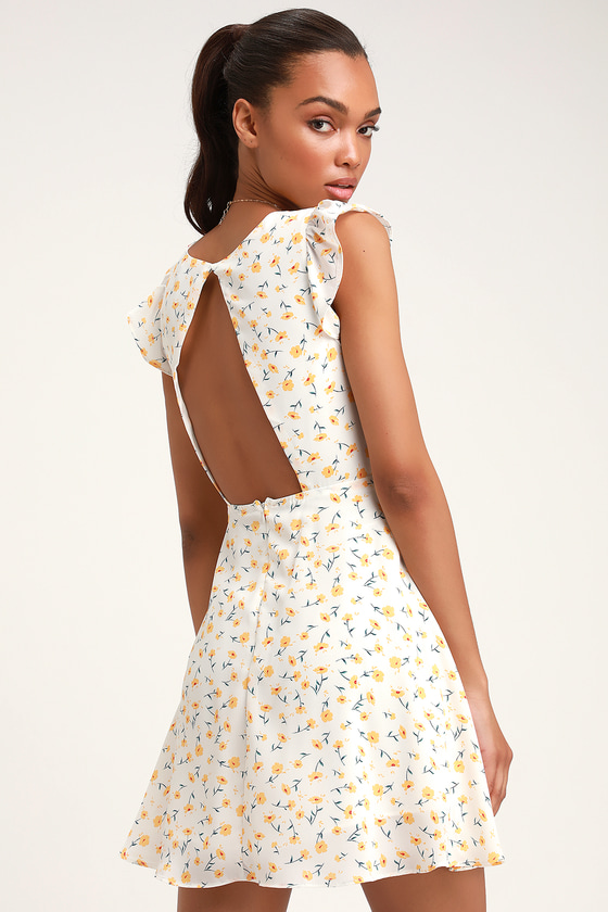 Strike a Posie White Floral Print Backless Skater Dress - Lulus Exclusive! The Lulus Strike a Posie White Floral Print Backless Skater Dress is picture perfect and prepared for any occasion! Fun and flirty floral print, in yellow, red, and green, decorates this sleek woven skater dress with a V-neck, princess-seamed bodice with darling covered-button detail, and ruffled short sleeves. Oversized cutout (with top button) adds a flirty peek of skin at back, while a flaring mini skirt falls below the fitted waist (with a bit of elastic at back). Hidden back zipper/clasp.