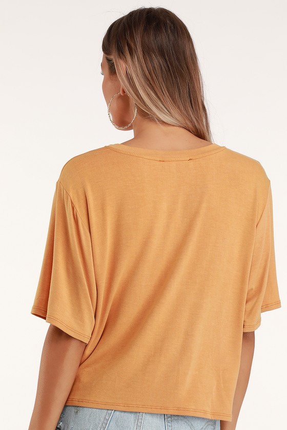 white and orange graphic tees