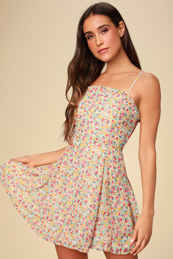 Whole Lotta Lovin' Ivory Floral Print Ruffled Skater Dress - Lulus Exclusive! We are florally impressed with the Lulus Whole Lotta Lovin' Ivory Floral Print Ruffled Skater Dress! Lavender, blue, red, orange, and green ditsy floral print dances across this sleek, woven skater dress with a ruffled square neckline and adjustable skinny straps. The princess-seamed bodice flows into a fitted waist and flirty skater skirt. Smocking and hidden zipper/clasp at back.