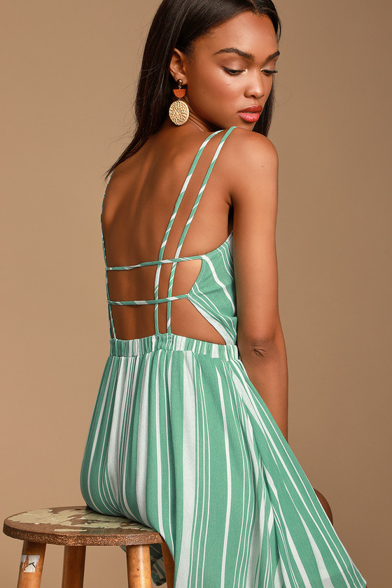 Oceanside Adventure Green Striped Backless Skater Dress - Lulus Exclusive! Spend the day searching for sea glass and starfish in the Lulus Oceanside Adventure Green Striped Backless Skater Dress! Sage green and white striped gauzy woven fabric swings from dual skinny straps, into a surplice bodice (with modesty stitch). Elasticized waist creates a comfy fit atop a perfectly breezy skater skirt. Strappy open back.