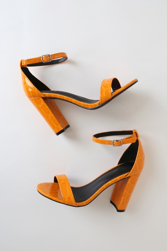 A Pair of Dark Blue Leather Womenâ€™s Shoes with Medium Heels Near a Square  Mirror on a Yellow-orange Background Stock Image - Image of cool, bright:  166195403