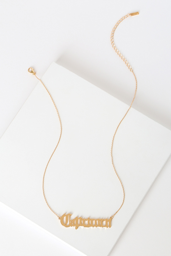 In Retrograde Gold Capricorn Script Zodiac Necklace 1
