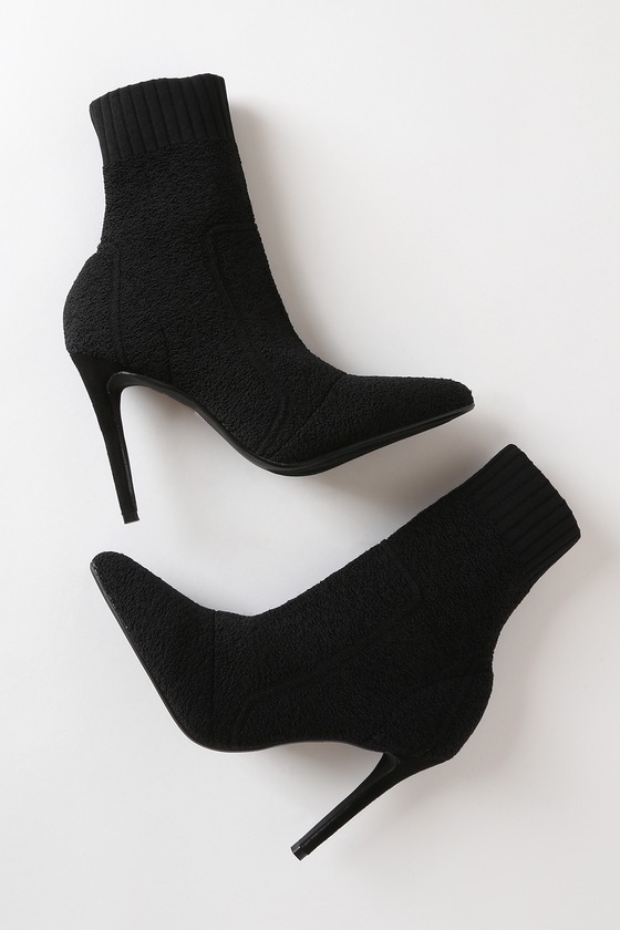 black high heeled sock boots