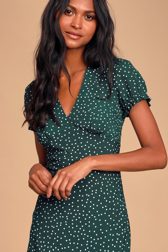 green dress with white polka dots