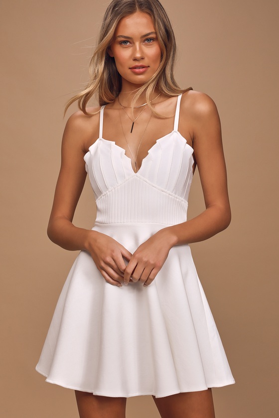 white sleeveless skater dress