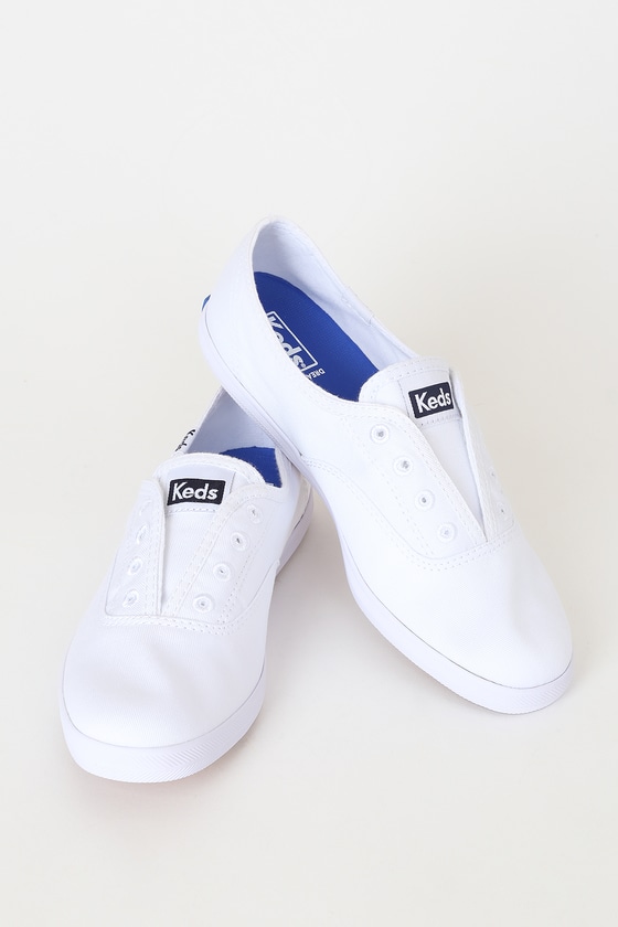 white canvas slip on sneakers