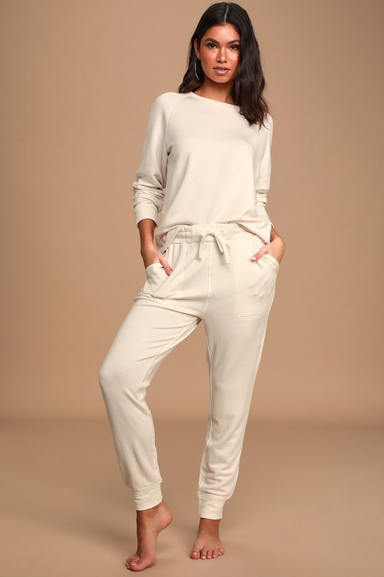cream sweatshirt and joggers