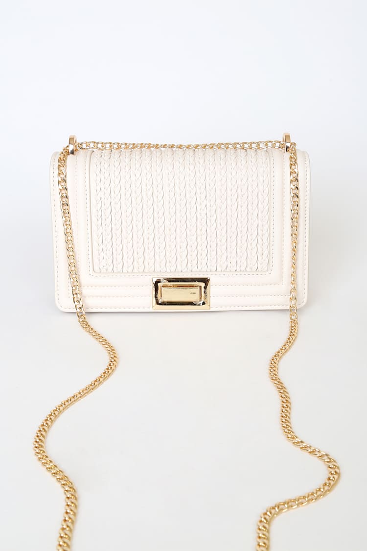 white purse with gold chain