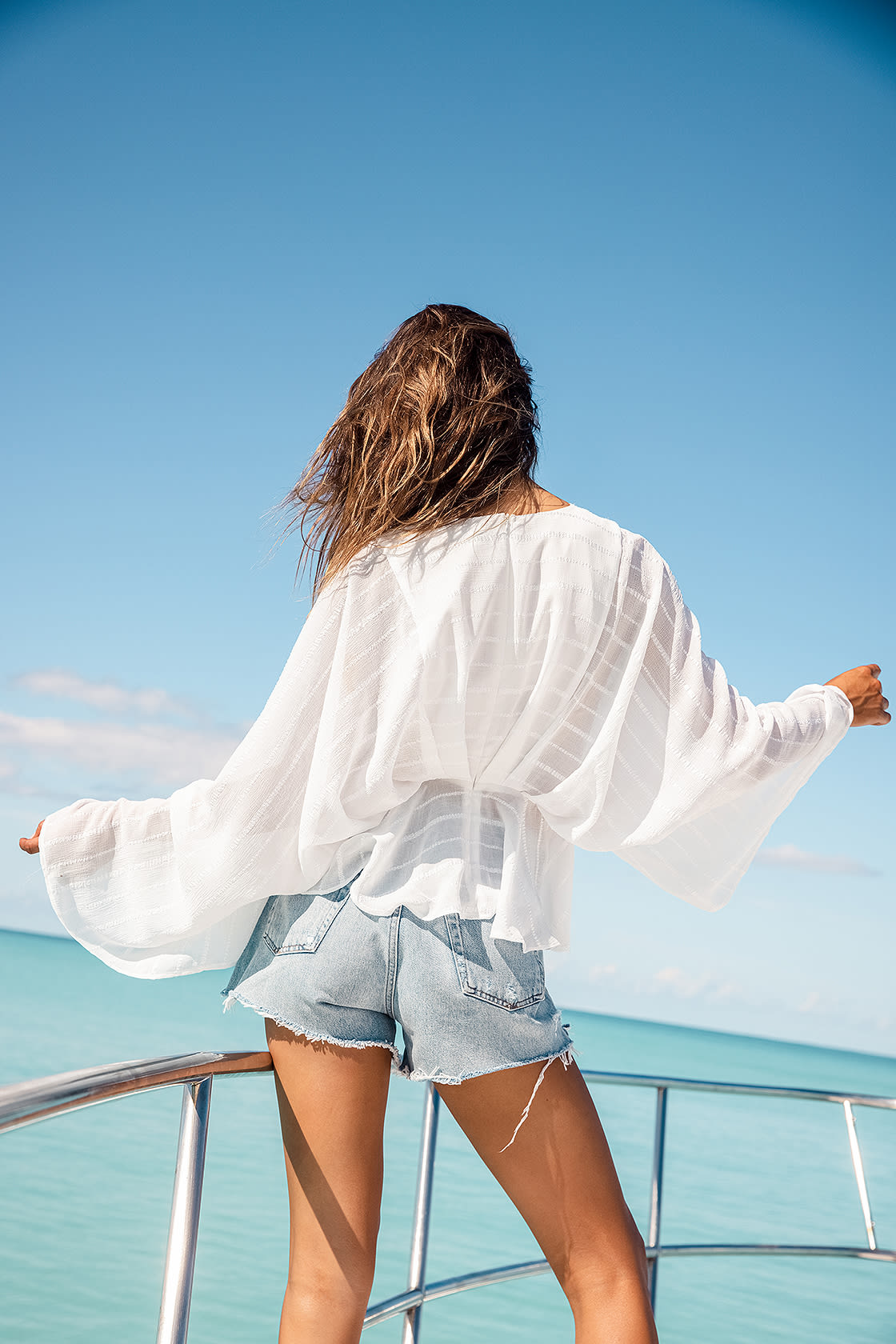 Jean Shorts with Flowy White Blouse for Summer Vacation Outfit