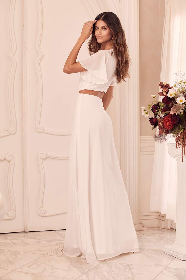 flared hem cut out maxi dress in ivory Ellie Ivory Flared Hem Cut Out Maxi Dress – Tomber Amoureux main image 1
