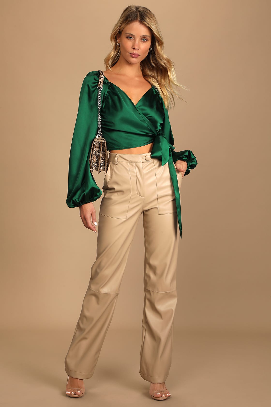 Emerald green satin shirt with beuge leather pants