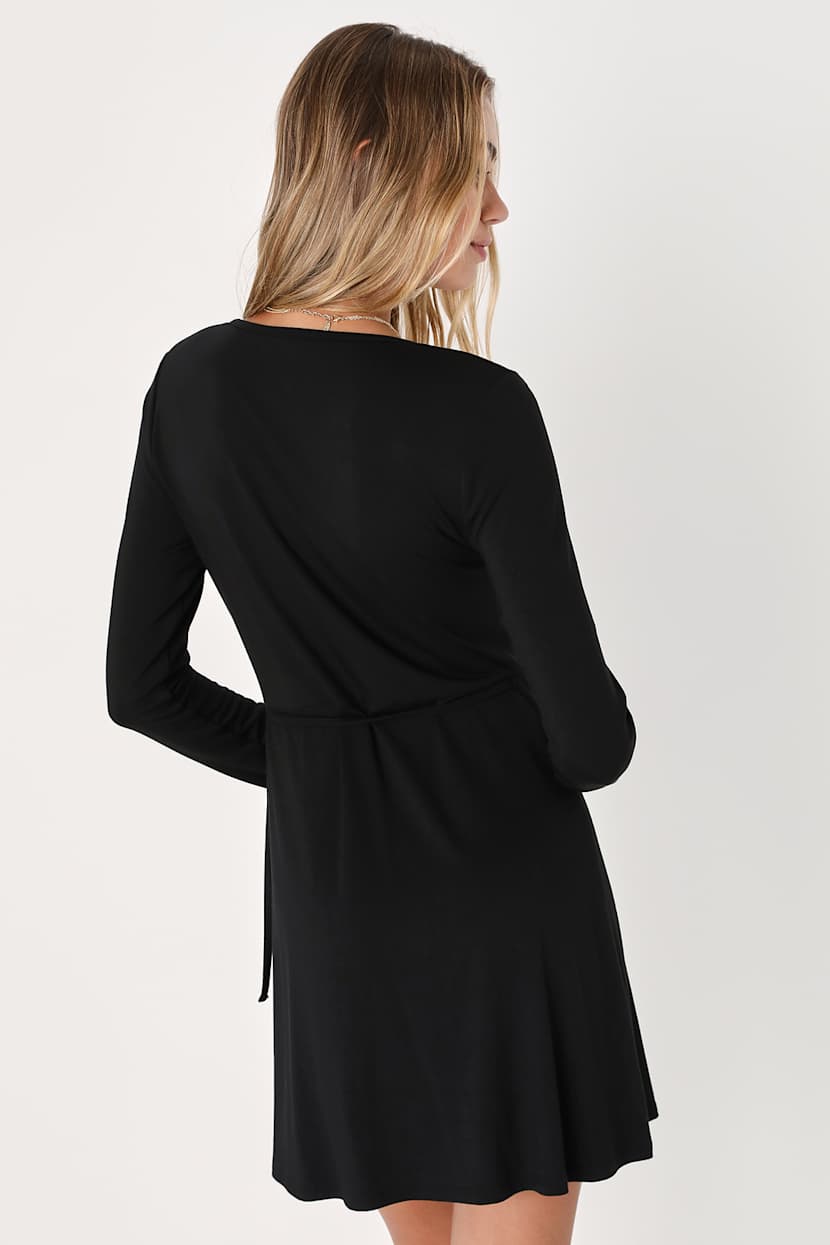 knee length dresses for ladies Bebe Women's Long Sleeve Faux Wrap Ruched Mini Dress main image 1