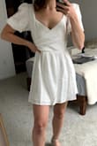 This dress is really cute. An XS was definitely the size for me (I tried a S as well but it was way too big). Even with an XS though I ended having to tailor the waist and the shoulders a bit to make them tighter. The sleeves have an elastic band that aren't too constrictive and the material is layered well (isn't see-through). With a few adjustments, I'd say this dress is perfect. The shoulders come a bit wide/loose - I have broad shoulders and thought it would be fine but still had to tighten them a bit. The photos are from before the alterations (you can see I'm holding the waist). The wrinkles go away pretty fast and can be steamed out! Very flattering dress! - Jerika C.