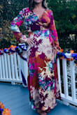 I wore this dress to an outdoor wedding and got so many compliments. 

I usually wear a small on top and a size 4 or 6 in jeans/pants. Based on the reviews I read before ordering, I decided to get a Large. I was worried the dress would be too long and that I would have to hem it. I wore a low wedge sandal and the length was perfect. I used fashion tape to keep the front from revealing too much. - Julie W.
