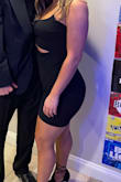 I was nervous about this dress because Im not a tight dress person, but it was perfect. It was tight but doesnt make your stomach look large. 
I wear a size 8/10 in jeans for reference and got a large but could have done a medium since it is stretchy. Loved it though!! Super cute!! - Tess C.