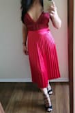I bought this skirt to pair it with Lulus Casita lace bodysuit for a wedding. The skirt is so comfortable and flattering. I had to get hemmed a bit, which was to be expected, as I am only 4'11. But, overall it fits true to size, purchased xs. I had received soo many compliments that night. I plan on buying it in the rust once it's back in stock. :) - Sophie L.