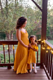 I love this dress! I was so scared the dress would not fit because I ordered it in my pre-pregnancy size, but the strings in the back made it adjustable and it fits perfectly. I got so many compliments on it! I did have to get the dress hemmed - Kayla F.