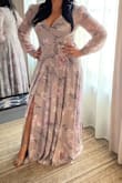 Purchased to attend a wedding. Runs true to size but very long, I didn't mind because I wore high heels with it and you could not see the shoes still. Very deep cleavage I used a pin to make it a bit more conservative. 
Looks just like the picture. It does not look or feel cheap. Got lots of compliments. - Betzaida R.