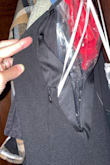 I love this dress and think it's absolutely perfect but the zipper is ridiculously positioned well above the line of the dress. You'll notice in all the model photos she never shows what's under her left arm, well, it's an unsightly zipper. I wish I could order another and confirm if this was a sewing mistake but it won't be restocked until after my event so I'll be seam taping the zipper folded down. It's a shame for such a nice dress and at full price! Other than that I'm surprised by the sizing as it runs a tad big. I ordered an XS since I'm fairly small busted and it fits perfectly. Normally I'd choose a small but with the stretch and deep v, I won't need to hem this or anything for the length! - Leigh H.